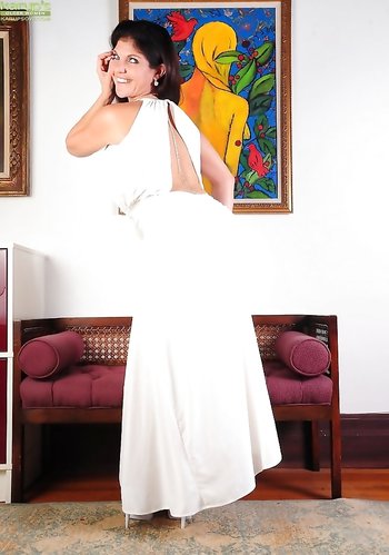 Buxomy Mature Coralyn Jewel naked spreading and fingering her tight asshole