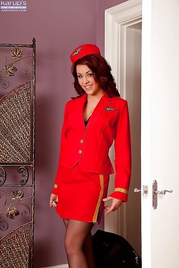 Naughty flight attendant in red uniform Amy Rose teases with her tits and ass
