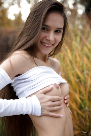 Skinny brunette teen Leona Mia poses as her tight slit is looking fantastic