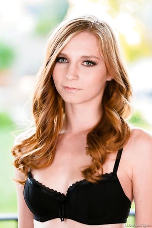 Pornstar Teen Ava Parker peels off her black lingerie to pose nude