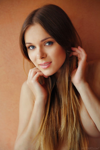 Beautiful euro babe Katie A strips and shows her irresistibly shaved pussy