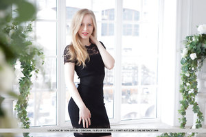 Beautiful young blonde Lola Chic strips her black dress and poses