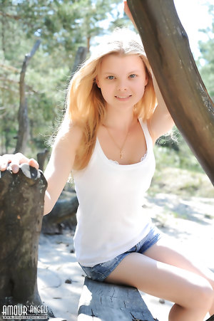 Platinum-blonde Teen Kisa A Wearing Jeans Shorts outdoors