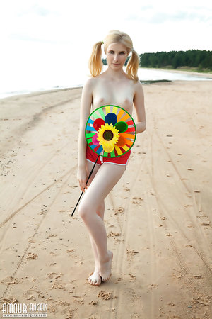 Teen Candy Bloom with Pigtails showing her nice slightly furry beaver