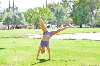 Athletic blonde Megan shows her boobs in the park and masturbates