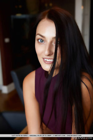 Ravishing dark hair babe Katy Rose strips her purple shirt exposing her breasts