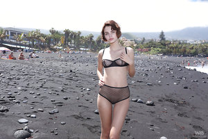 Sexy short haired brunette Lilit Ariel in see through lingerie outdoors