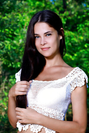 Long haired Martina Mink in tight miniskirt flaunting her big tits and sexy ass outdoors