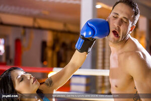 Boxer babe Rina Ellis sits on the instructors thick piece of wood