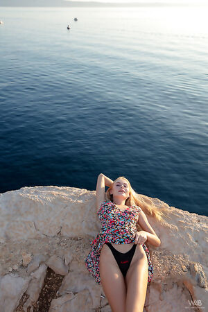 Slim blonde beauty Nancy A messes around while stretching pussy in public