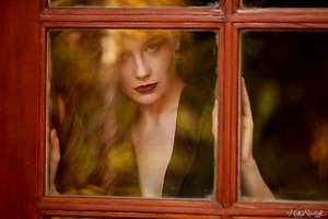 Slim Ukrainian girl Emily Bloom in thong strips out of her lingerie