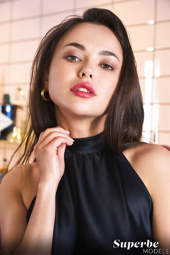 Classy euro babe Li Moon poses erotically and stretches out her meaty labia lips