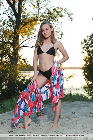 Blonde teen Lucretia K is the only nudist on the beach